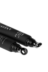 Two black lip products with visible branding on a white background